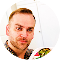 Google account profile picture of Gary holding a tray of food in front of him.